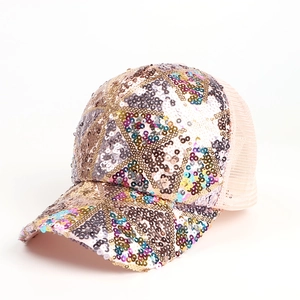 Detail of sequined mesh baseball cap showing colorful geometric patterns and breathable net