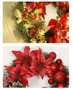 Detail of red poinsettia and ornaments with warm LED lights on a pine wreath