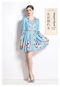 Detail of a sky blue V-neck floral mini dress with long sleeves and a matching waist belt