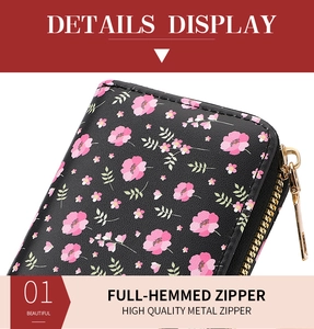 Macro view of floral print card holder with high quality metal zipper and leather texture