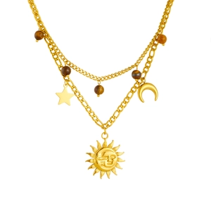 Vintage gold-plated layered chain necklace with sun, moon, and star pendants with tiger eye beads