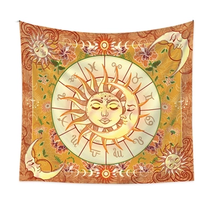 Macro detail of sun and moon tapestry featuring twelve zodiac signs in golden tones