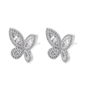 Macro shot of butterfly wing earrings with detailed silver plating and cubic zirconia inlay