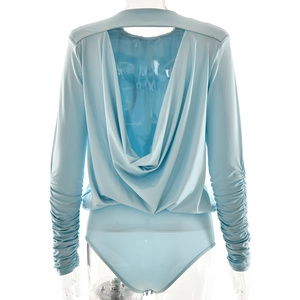 Detail of light blue bodysuit featuring a draped open back and ruched long sleeves