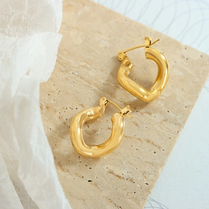 Chunky gold-plated 18k titanium steel hoop earrings with a twisted lava-like texture