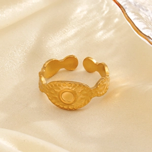 Minimalist gold oval signet ring with hammered texture and adjustable open band design