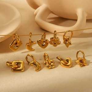 Polished gold stainless steel earring set with heart, star, and moon shaped charms
