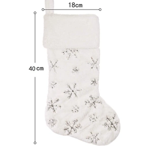 Detailed size view of white plush Christmas stocking with silver snowflake embroidery