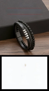 Detail showing multi-layer braided leather bracelet with volcanic stone and steel magnetic clasp