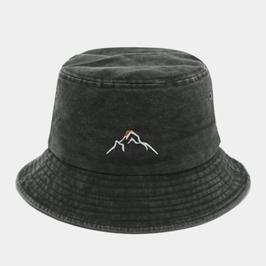 Close-up of vintage washed cotton bucket hat with mountain sunset embroidery and air vents