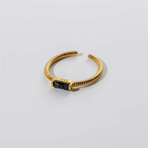 Close-up of S925 hallmark on gold plated twisted ring with black square zircon
