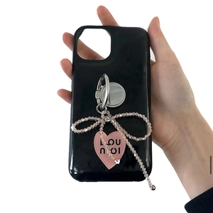 Glossy black phone case with silver ring holder and pink beaded bow heart charm