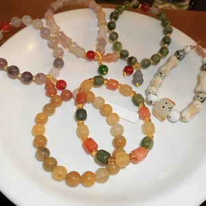 Handmade Bodhi seed beaded bracelets with cute puppy charms and colorful natural stones