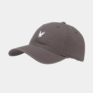Detail of high-quality charcoal cotton baseball cap with white eagle embroidery on front