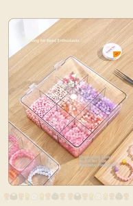 Clear acrylic 9-grid storage box for DIY beads and jewelry findings on wooden table