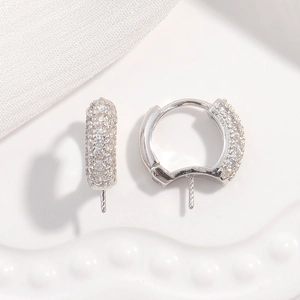 Macro shot of S925 sterling silver U-shape earring hooks with sparkling zircon details