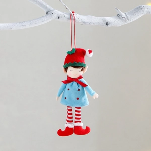 Christmas elf plush ornament in blue and red hanging on a decorative white branch