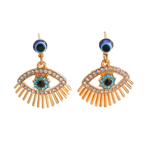 Gouden Evil Eye kwastjes oorbellen met blauwe en witte strassteentjes op wit