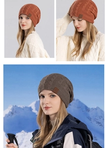 Close-up of thick cable knit beanie with outdoor logo patch and soft warm texture