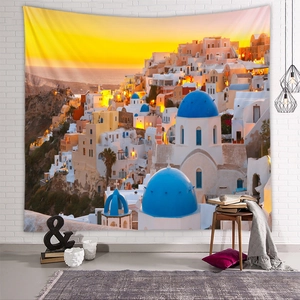 Santorini sunset tapestry detail showing iconic blue domes on a cozy white brick wall