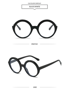 Front and side views of vintage round black frame sunglasses with a minimalist aesthetic