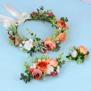 Handmade floral hair accessory set with orange and white flowers and a green leaf wreath