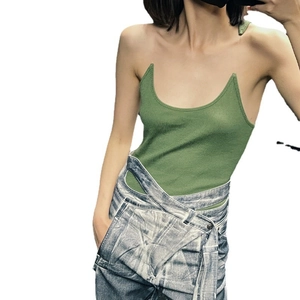 Sexy green knitted tank top with U-neck paired with washed blue denim overalls
