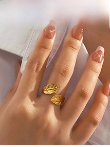 Detailed view of an adjustable golden leaf ring featuring intricate vein textures