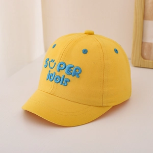 Detail view of vibrant yellow cotton kids baseball cap with blue 3D SUPER idols embroidery