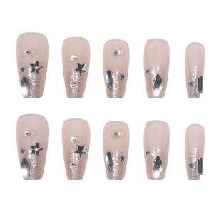 Sparkly nude bridal press-on nails with silver glitter stars and luxury rhinestones