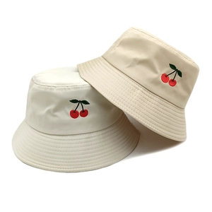 Minimalist cotton bucket hats with cherry embroidery in off-white and khaki colors