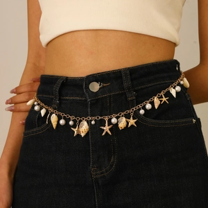 Bohemian gold chain waist belt with shells and pearls on denim shorts for summer beach