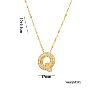 Detailed view of gold 18K plated letter Q pendant with cubic zirconia and size dimensions