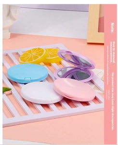 Macro view of portable macaron folding mirrors showing matte texture and compact design