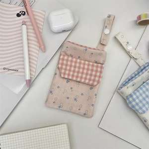 Nurse pocket organizer pouch in pink floral design on office desk with stationery