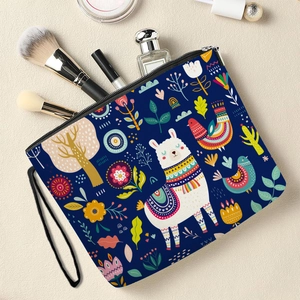 Alpaca floral print makeup bag in navy blue with a portable wristlet and secure zipper
