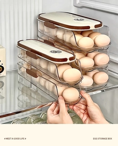 Detail view of multi-layer transparent egg storage box with automatic rolling design in fridge