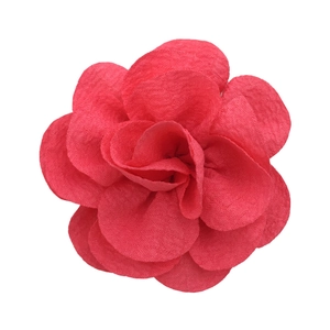 Detailed view of a 7cm pink bubble crepe handmade flower accessory on a white background