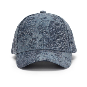 Detailed view of deep blue baseball cap with shiny silver glitter snakeskin texture