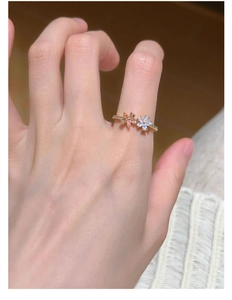 Detailed close-up of double flower S925 silver ring with opal and pink stones on hand