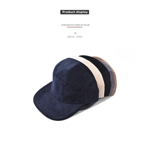 Detailed corduroy texture and five-panel construction of the classic baseball caps