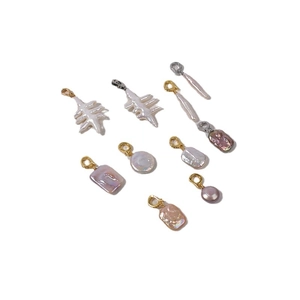 Baroque freshwater pearl pendants with gold and silver clasps on white background