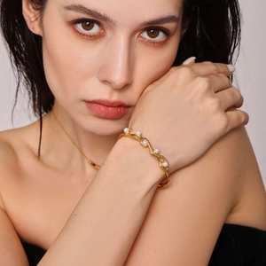 18K gold plated C-shaped cuff bracelet with irregular wave texture and inset pearls