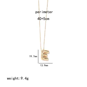 Detail view of 3D rounded golden letter E pendant with necklace size and weight specs