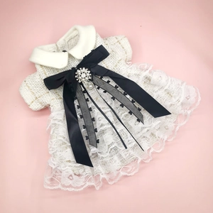 Elegant white tweed pet dress with lace trim and black bow for small dogs and cats
