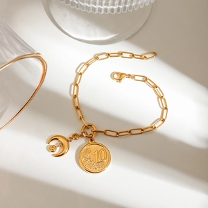 Gold-plated stainless steel chain bracelet with moon charm and euro coin pendant