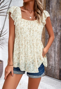 Detail of square neck floral blouse with ruffled short sleeves and tiered hem design