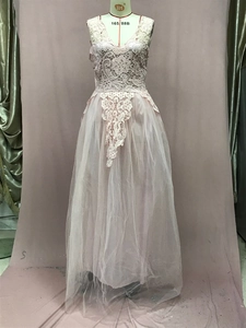 Detailed view of pink lace bodice with V-neckline and multi-layered tulle skirt