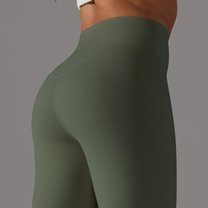 Detail of high-waist olive green yoga pants showing V-shaped back seam and lift effect