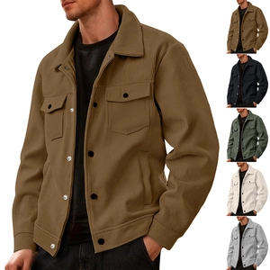 Detail of men's corduroy jacket with chest pockets and button placket in brown color